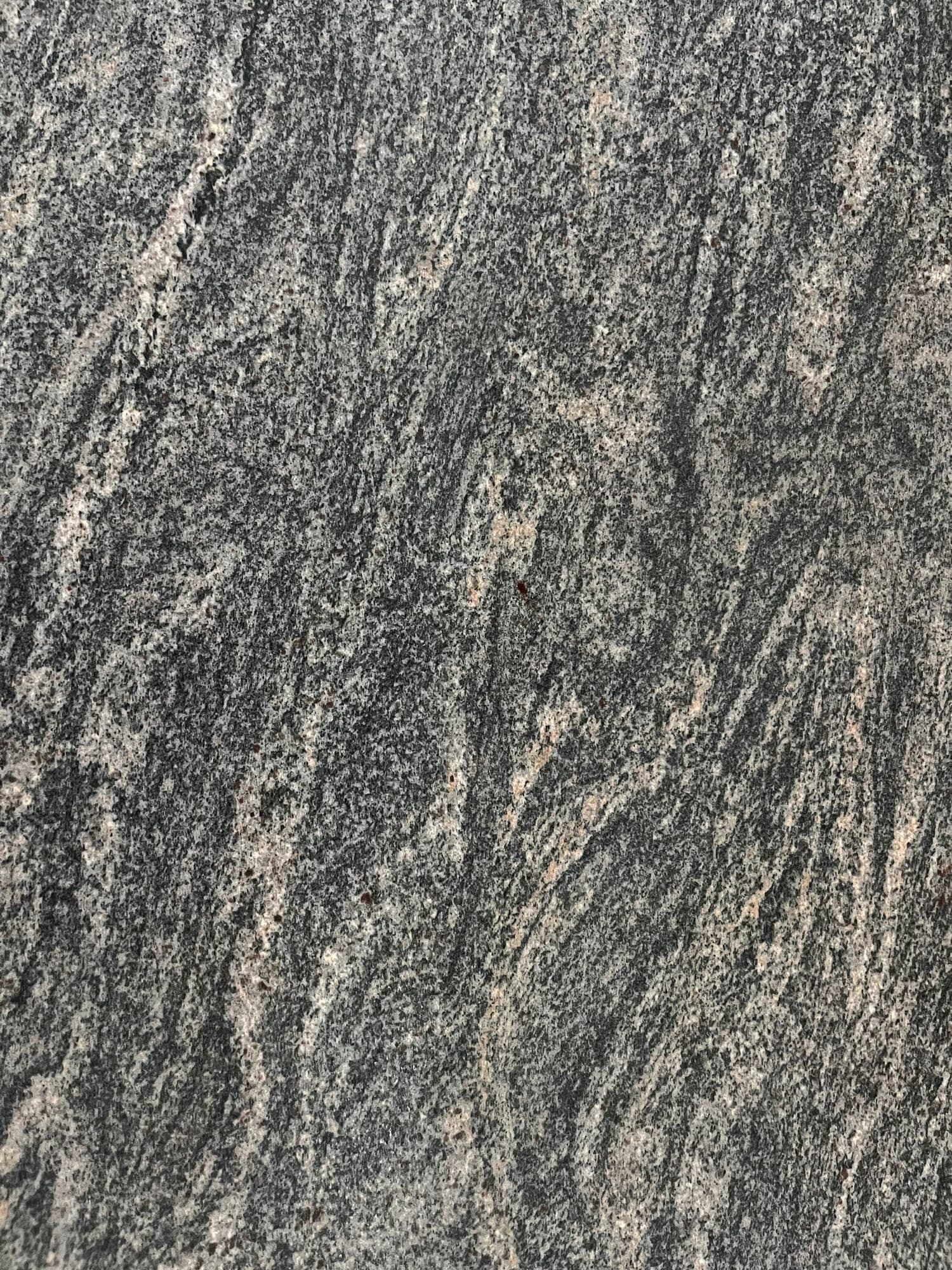 Grey-green granite surface with pale veining