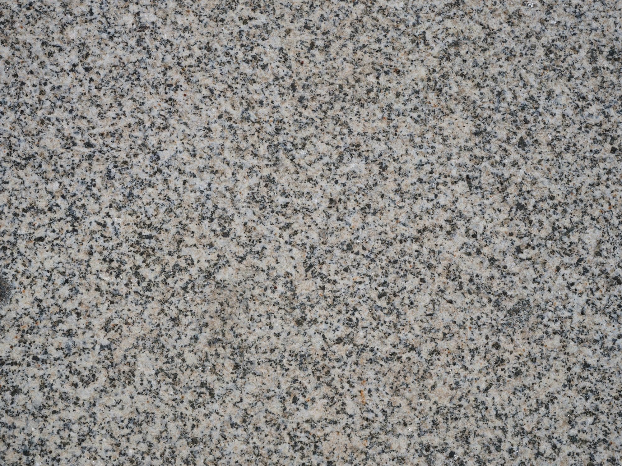 Grey granite surface with an even black and white speckle
