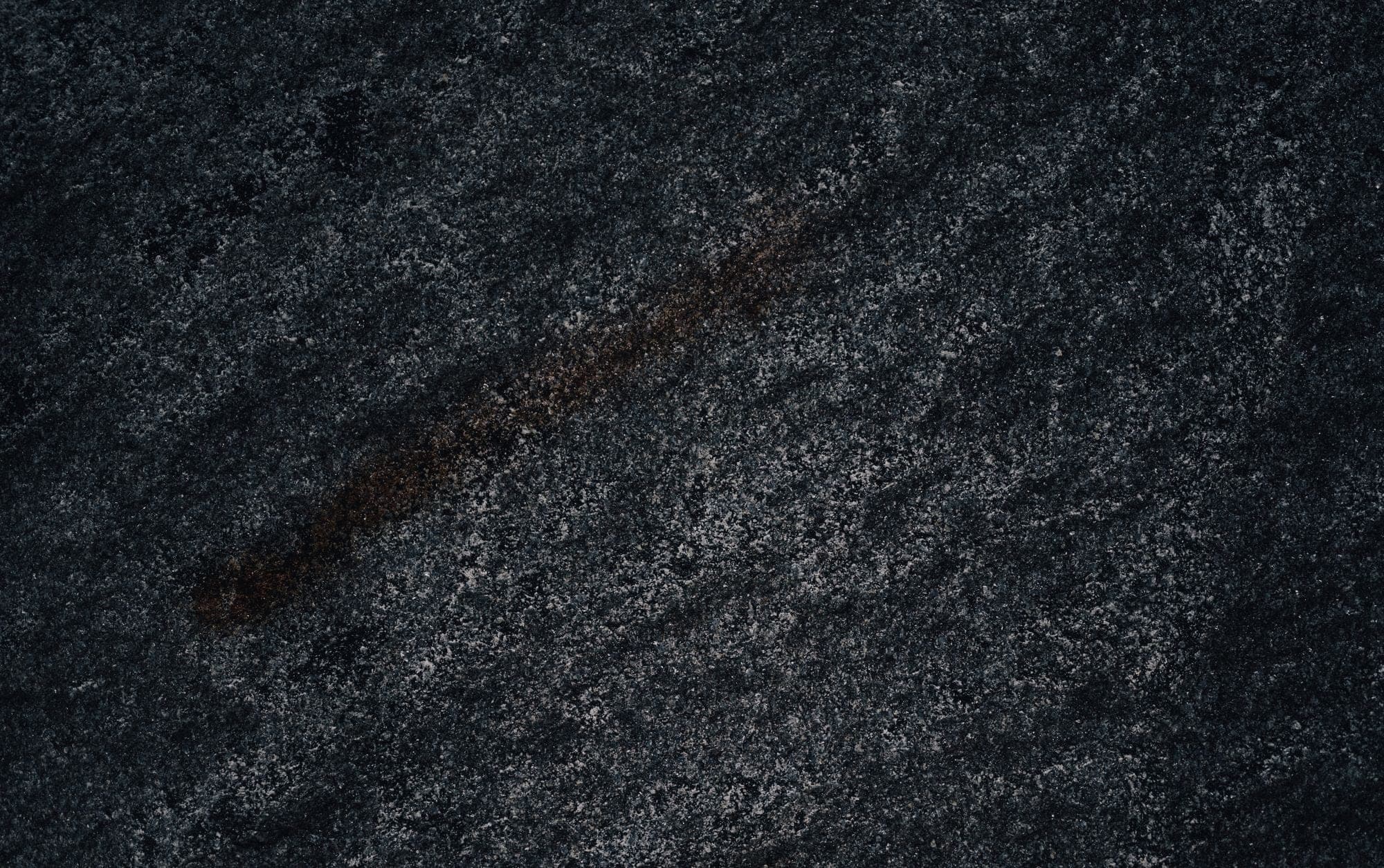 Charcoal granite surface with a fine even speckle