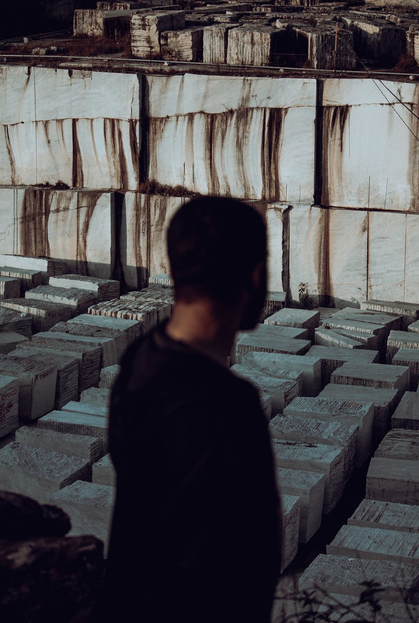 Sawn stone blocks stacked in rows in a yard