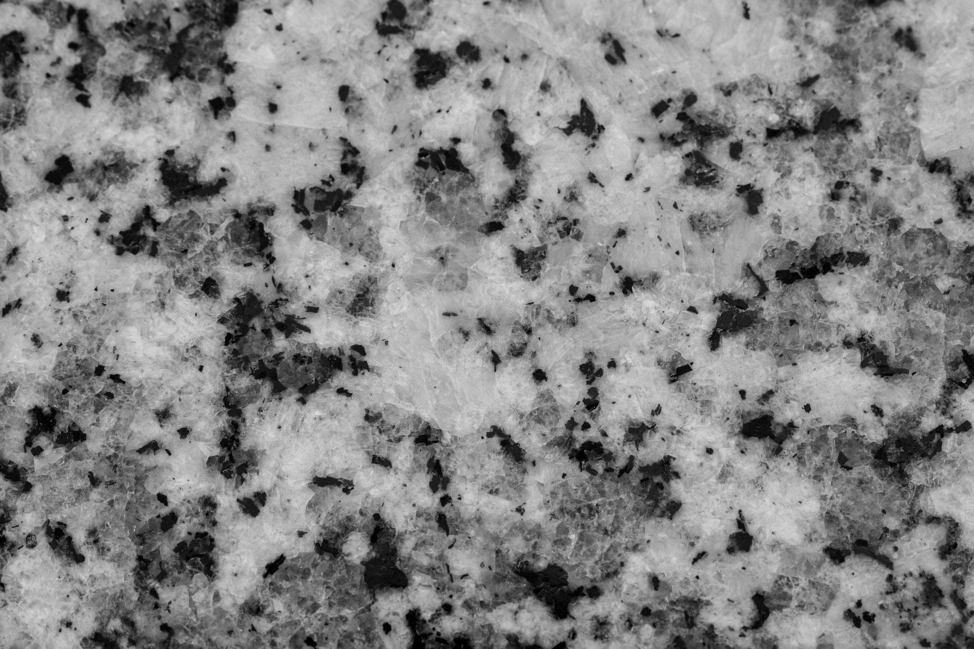 A light granite surface with an even dark speckle